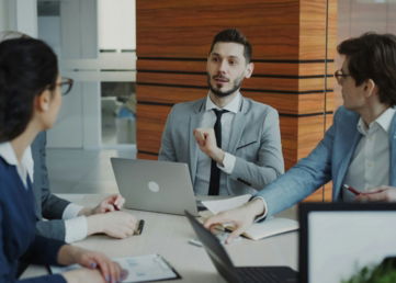 Business people collaborating in a modern office meeting.